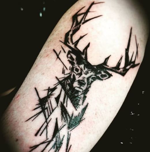 deer on forearm black ink tattoo