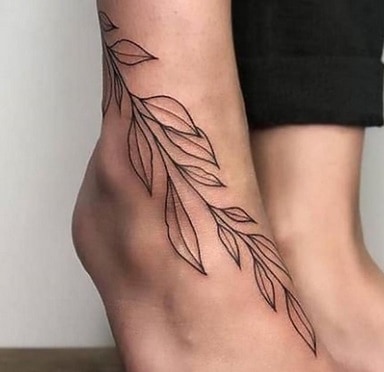 idea flower tattoo on foot