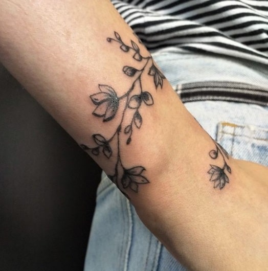 flower bracelet tattoo on wrist