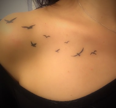 for women bird tattoo on the clavicle 