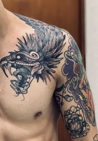 for men dragon tattoo on the clavicle 