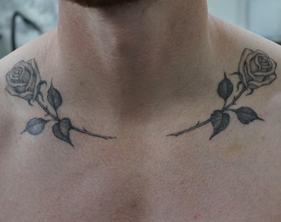 for men rose tattoo on the clavicle