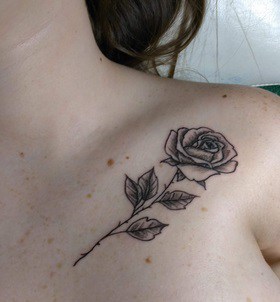 for women rose tattoo on the clavicle 