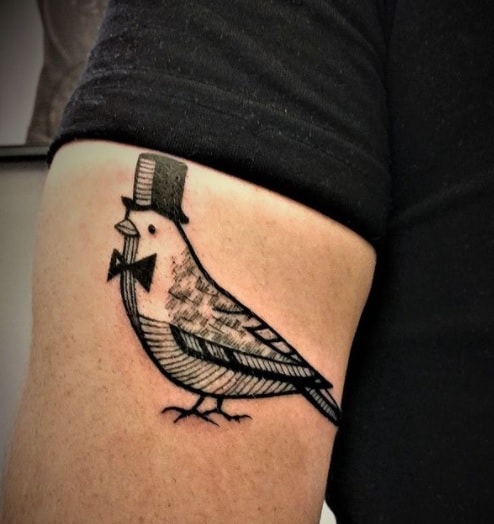 pigeon tattoo on arm