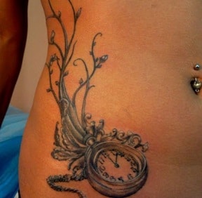 clock tattoo on the stomach
