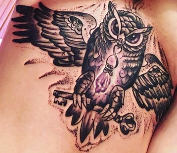 owl tattoo on the stomach