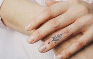 small and always visible tattoo on finger
